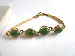 Vintage gold tone herringbone chain with 4 faux jade cab stones bracelet