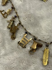 Pididdly Brass Necklace tiny Purple Glass Beads and 15 Mechanical Charms Vintage