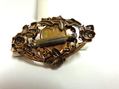 vintage gold tone cameo pin in floral frame sz 2 in wide wgt 9.6 grams girl bust
