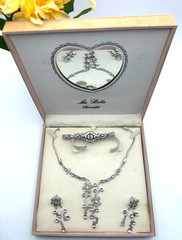 Delicate silver plated metalwork w pink and white stones in floral arrangement