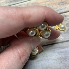 Pierced faux pearl cabochon dangle earrings in gold tone metal