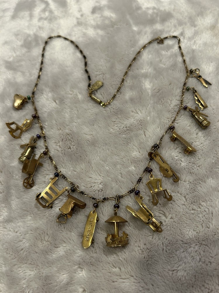 Pididdly Brass Necklace tiny Purple Glass Beads and 15 Mechanical Charms Vintage