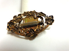 vintage gold tone cameo pin in floral frame sz 2 in wide wgt 9.6 grams girl bust