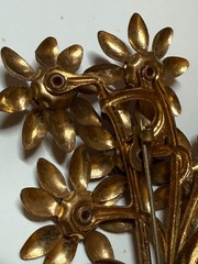 Vintage flower brooch gold tone C Clasp stamped brass red stones prong set