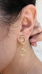 Authentic Christian Dior monogram logo clip-on earrings from the 1990s – Gold