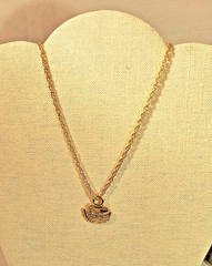 Bright gold tone Noah’s Ark pendant and 24 inch gold tone chain necklace