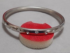 Crystal polka dot bangle bracelet Silvertone flush set stones eternity band