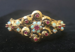 Spectacular Victorian 14K Yellow Gold Bangle Bracelet w/ Rubies and White Opals.