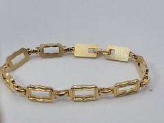 Vintage gold-tone clamper bracelet with an openwork square link design 8.5in