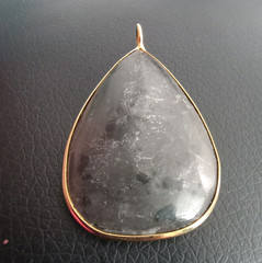 Trilobite fossil pendant gold rimmed metal teardrop shape, large