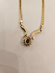 Gold tone necklace with black stone and cz’s.