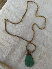 A braided red copper necklace a medium-sized, rare pear-shaped pure turquois