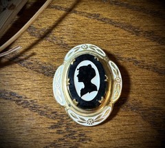 Antique Victorian gold and white colored brooch with black and white glass cameo