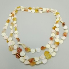 Vintage Long Single Strand Orange and Cream Beaded Necklace Plastic Leaf Shapes