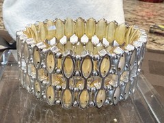 Vintage with an expandable Lucite bracelet in great condition. 1.5″ wide
