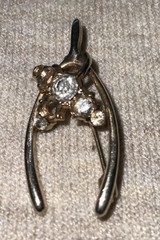 Gold Tone Wishbone Vintage Brooch With Clear Rhinestones ** Missing Stones