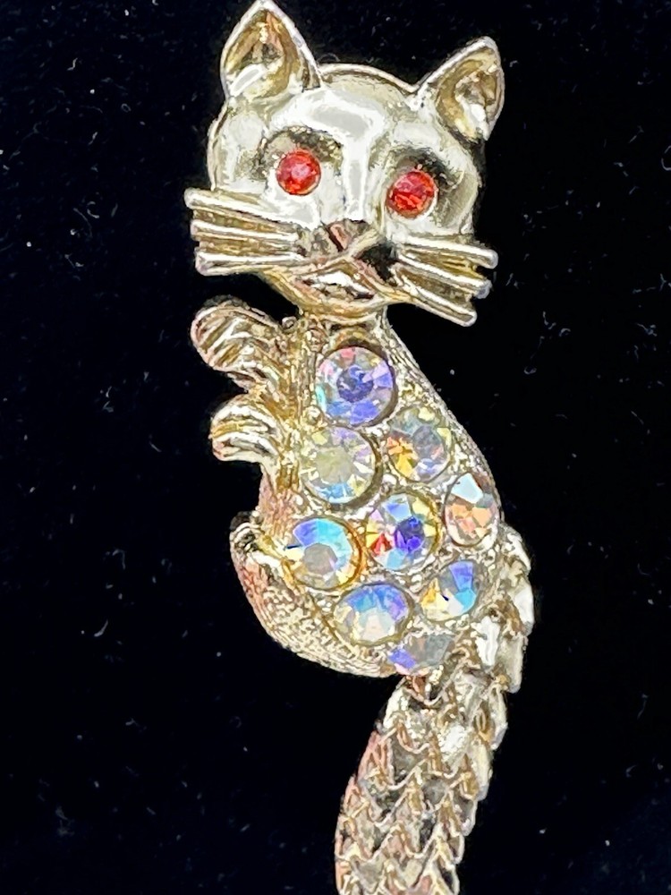 Bejeweled Feline Brooch Gold Tone With Man Made Aurora Borealis And Red Stones