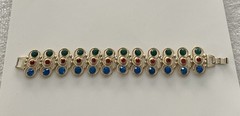 Vintage Gold Tone multi-gemstone link bracelet with a fold-over clasp 7’ in