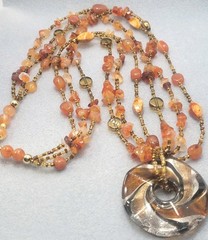 Multi-strand piece amber-toned Glass Gemstone Beads, large round pendant 26in.