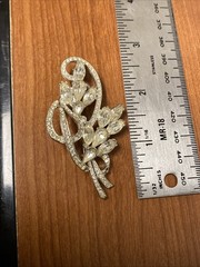 vintage rhinestone floral spray brooch, similar to designs from the 1940s-1950s