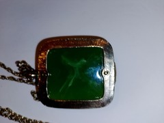 Nice faux jade gold tone necklace with strip of rhinestones. 19″ total 2″ stone