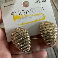 Signed sugarfix rhinestone egg shaped pierced earrings in gold tone