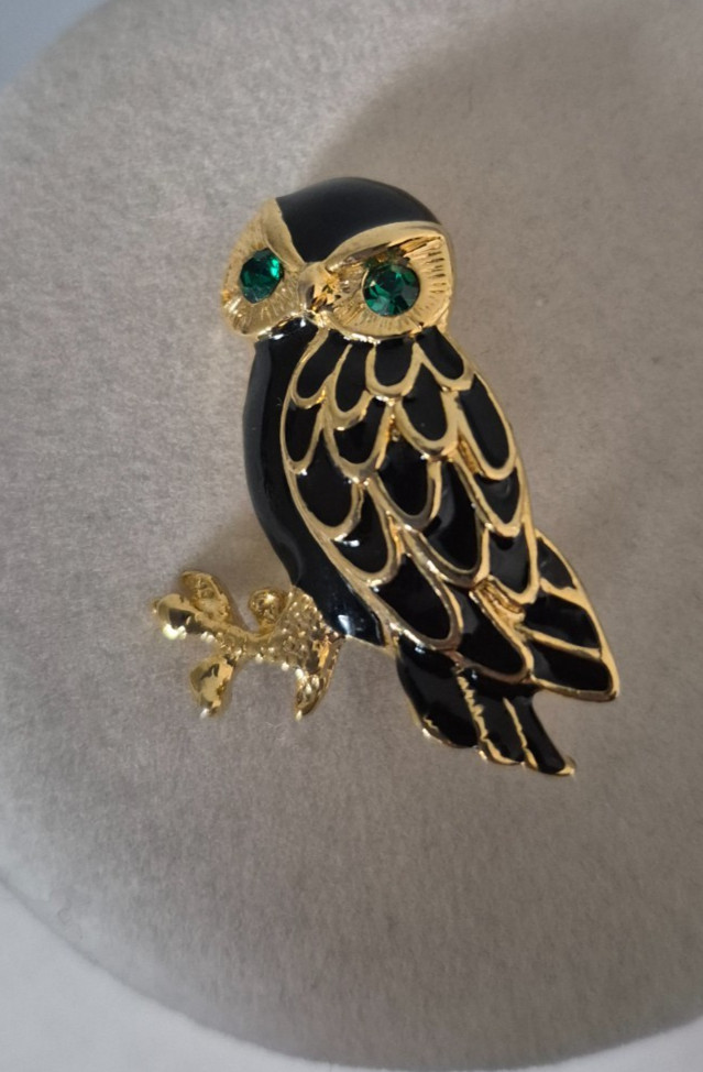 Cute, vintage owl brooch with black enamel and green rhinestone eyes