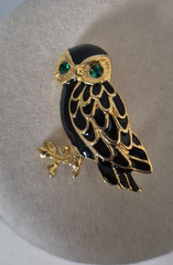 Cute, vintage owl brooch with black enamel and green rhinestone eyes