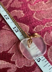 Vintage Avon frosted glass apple pendant on a gold-tone chain