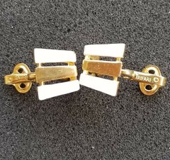 VINTAGE 1955-1969 TRIFARI GOLD TONED METAL AND WHITE ENAMEL CLIP ON EARRINGS