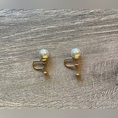 Vintage women’s stamped metal, gold color, and faux pearl earrings