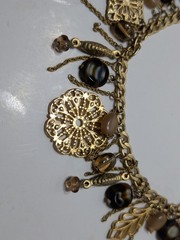 ✨VINTAGE✨ 16″ Ornate Gold Tone Dangling Necklace w/ Charms, Stones & Beads