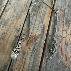 Faux pearl filigree cone necklace in silver tone metal on box chain