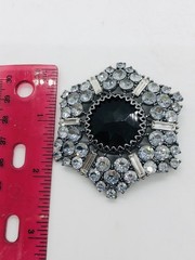 Rhinestone brooch with central black rhinestone