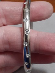 Crystal polka dot bangle bracelet Silvertone flush set stones eternity band