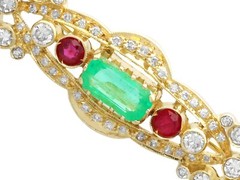 0.93ct Emerald, 0.24ct Ruby and 1.04ct Diamond, 18ct Yellow Gold Brooch