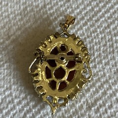 Cameo Pendant/brooch On Orange Background With Stones On Goldstone Setting