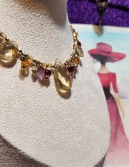 Vtg Cookie Lee faceted Purples/Yellows Lucite Charm Necklace on pale Gold chain