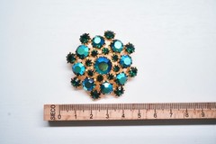 Vintage brooch Gablonz rhinestone green & blue-iridescent star.