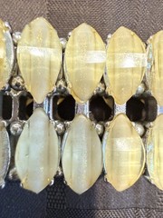 Vintage with an expandable Lucite bracelet in great condition. 1.5″ wide