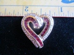 14K Solid Gold, (16) Diamonds & (22) Ruby’s. Heart Pendant.