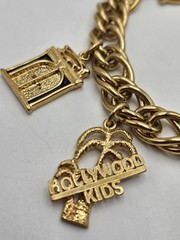Vintage Jackie Collins Gold Tone Enamel Lady Boss Charm Bracelet Toggle Clasp