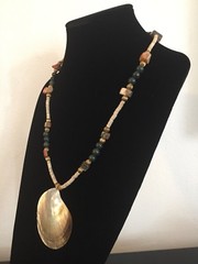 Shell Pendant on a Green, Gold, and Tan Necklace – 25.25 in.