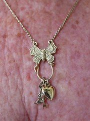 Vintage “1928 Jewelry” Gold Tone w/Butterfly Charm Holder w/Charms