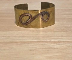 vintage mixed-metal cuff bracelet featuring S spiral design from 1950s-1970s.
