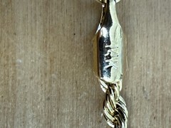 1 Watch, (2) 14 Karat Gold Plated Necklaces, (1 ) 14 Karat Gold Plated Bracelet