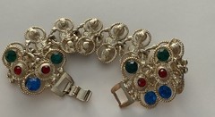 Vintage Gold Tone multi-gemstone link bracelet with a fold-over clasp 7’ in
