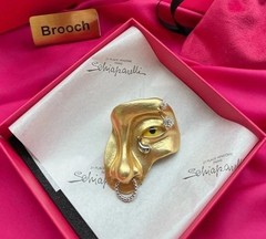 Schiaparelli yellow eye nose brooch with box