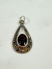 Sterling Silver Teardrop Pendant with Reddish Brown Faceted Oval Stone – 1″