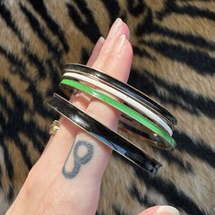 S Set of 4 Vintage Metal and Black, White, and Green Enamel Bangle Bracelets